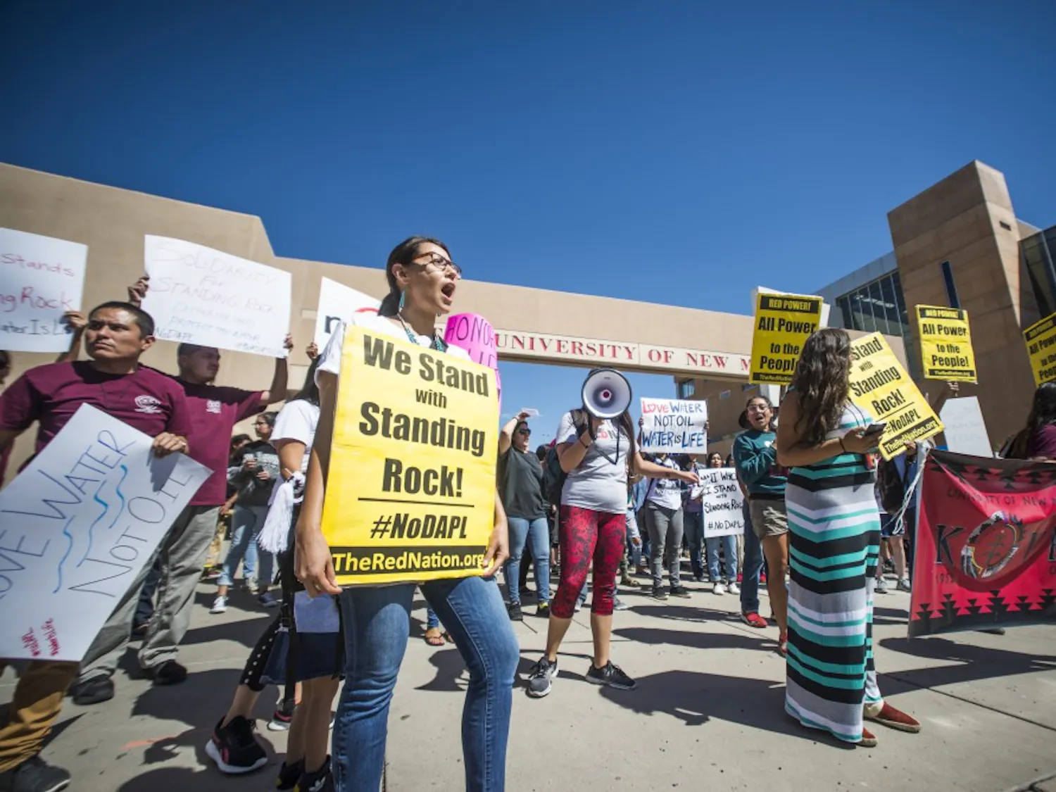 Protestors chant in front of the UNM Bookstore as part of a protest against the Dakota Access Pipeline. 