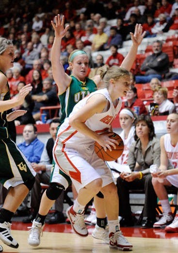 Amy Beggin maneuvers out of a half-court trap on Tuesday at The Pit. UNM outlasted Utah Valley 84-70. Beggin scored 17 points. 