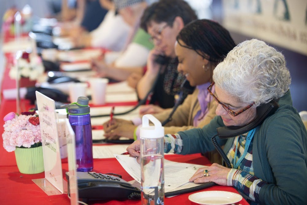 Julia Grimes, director of child life at UNMH, talks to a donor on Friday afternoon. UNMH held their annual radiothon on Thursday and Friday to raise money for the children's hospital.