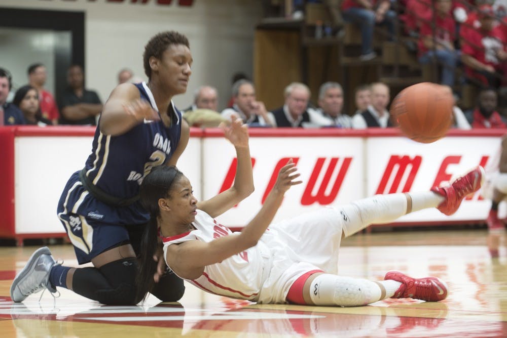New Mexican guard Kenya Pye falls to the court trying to collect a loose ball during Mondays Women?s Basketball Invitational game against Oral Robert Monday night at the Johnson Gym. Lobos lost 63-61.