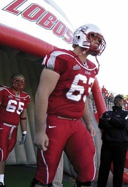 Former Lobo center Ryan Cook takes the field at the beginning of the Lobos' game against Air Force at University Stadium in November.
