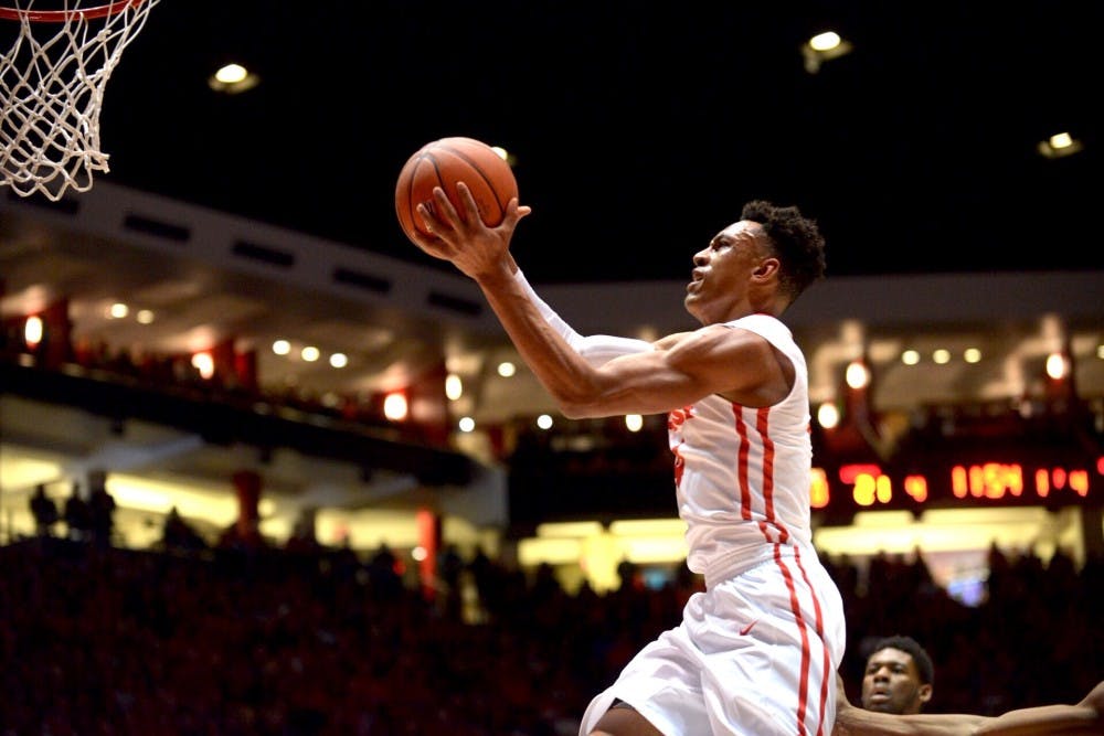 Redshirt sophomore guard Elijah Brown scores against Utah State at WisePies Arena Saturday night. The Lobos won 77-59.&nbsp;