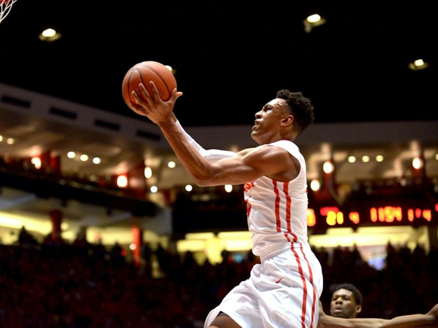 Redshirt sophomore guard Elijah Brown scores against Utah State at WisePies Arena Saturday night. The Lobos won 77-59. 