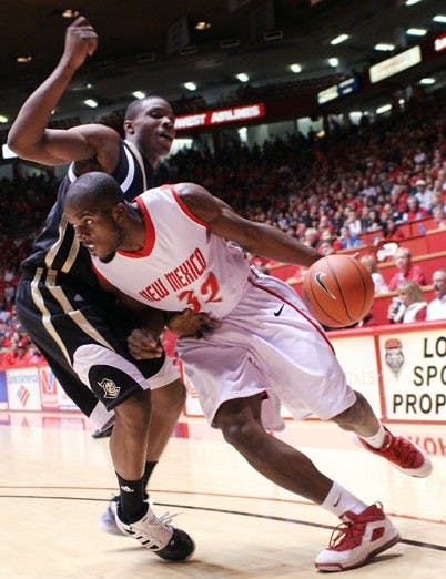 Tony Danridge drives past a UCF defender on Saturday at The Pit. Danridge added 13 points, but the Lobos blew a 9-point lead with less than four minutes left in the game. The Golden Knights squeaked by 72-71 off a last-second 3-pointer.