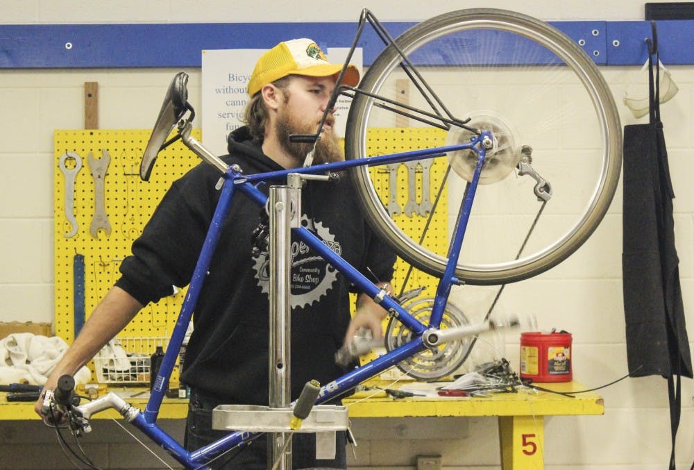 Ryan Fowlds repairs a Kuwahara Cougar Thursday afternoon for the shop’s “Earn-a-Bike” program. The program aims to teach adults proper bike safety and maintenance. Upon completing the course, participants have the opportunity to earn a refurbished bicycle and helmet. There is a course fee of $10 per class.