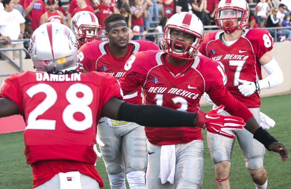 New Mexico redshirt freshman quarterback Lamar Jordan (13) celebrates a touchdown with teammates during the Sept. 6 game against Arizona State. Jordan will replace junior quarterback Cole Gautsche, who may miss the rest of the season with a significant foot injury, as New Mexico’s starting quarterback.