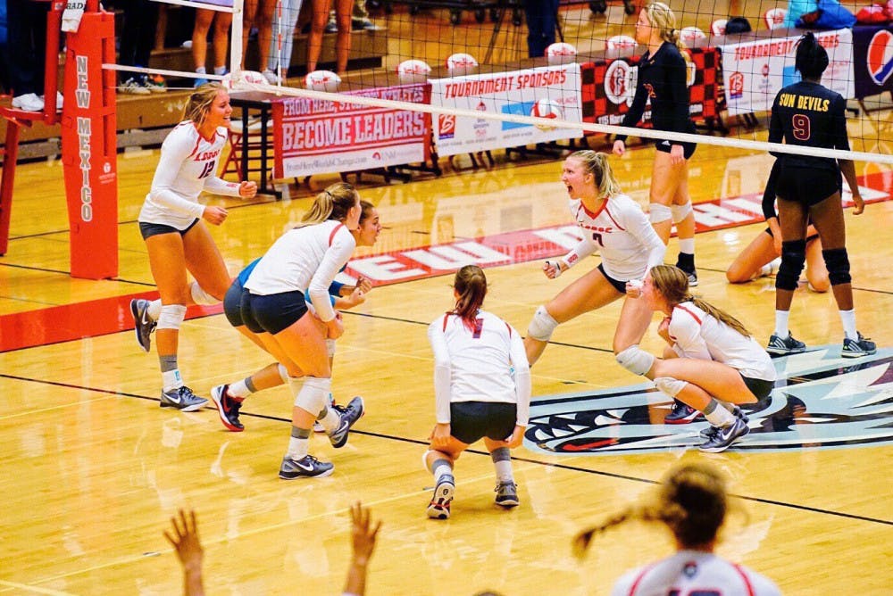 UNM celebrates set point to win the third game of the match against Arizona State on Friday, Aug. 26, 2016 at Johnson Center. The Lobos finished their USF Tournament in Tampa, Florida with a 3-0 victory over Western Carolina.