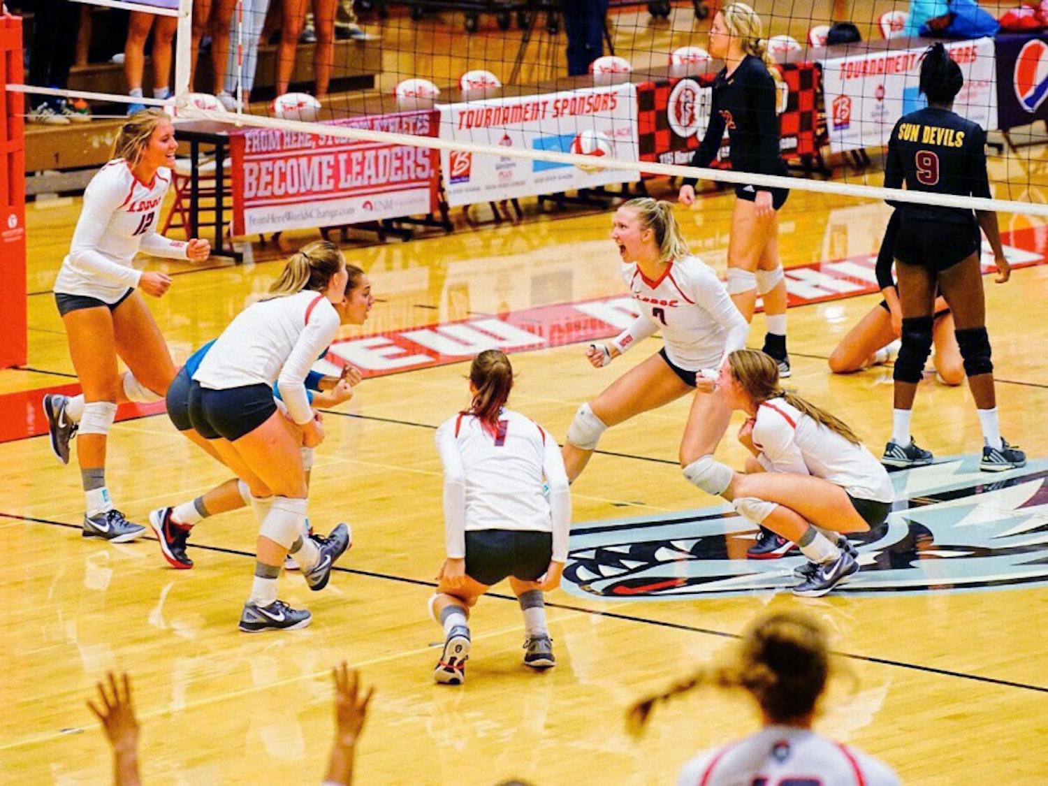 UNM celebrates set point to win the third game of the match against Arizona State on Friday, Aug. 26, 2016 at Johnson Center. The Lobos finished their USF Tournament in Tampa, Florida with a 3-0 victory over Western Carolina.