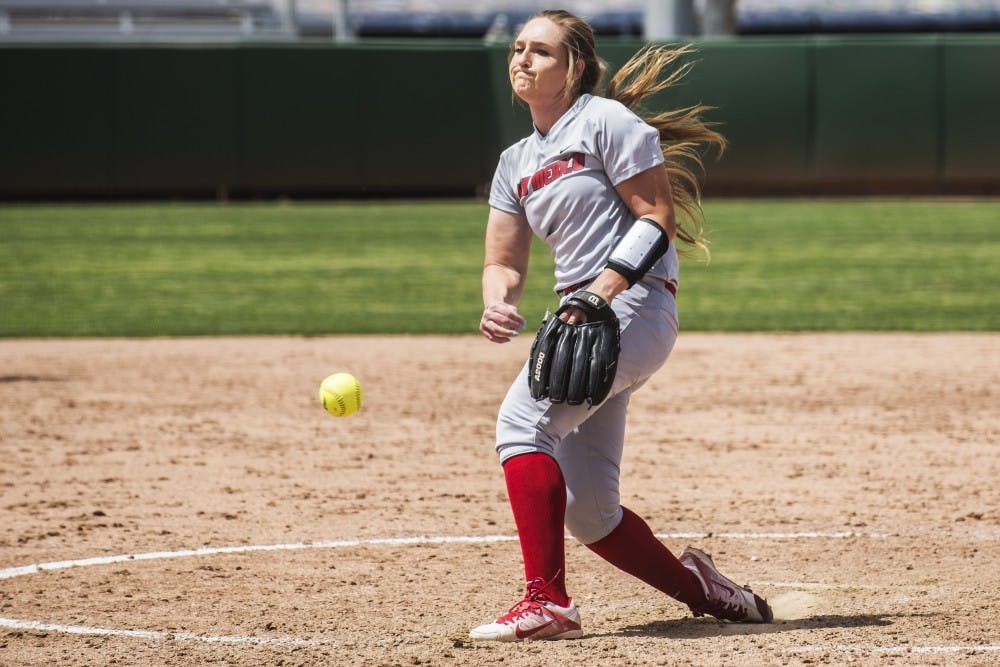 Freshman pitcher Collette Robert pitches against a Fresno State batter Sunday afternoon at the Lobo Softball Field. The Lobos were swept by Fresno State this weekend by a combined score of 28-8.
