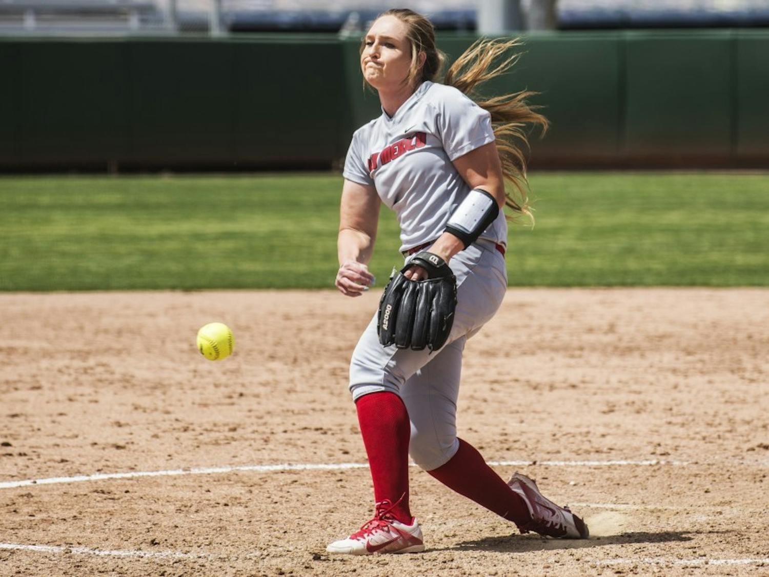 Freshman pitcher Collette Robert pitches against a Fresno State batter Sunday afternoon at the Lobo Softball Field. The Lobos were swept by Fresno State this weekend by a combined score of 28-8.