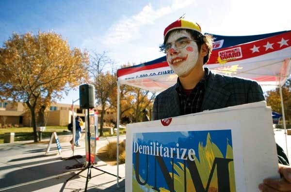 Mike Butler, a member of anti-war group Carnival Insurgente de Albuquerque, dressed up as a clown Wednesday to protest a National Guard booth in front of the SUB. 