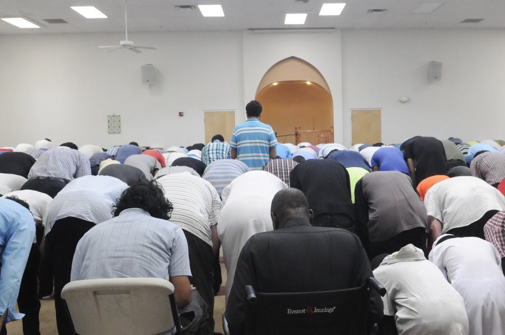 Muslim citizens pray during Praying Session on Friday afternoon in the Albuquerque Islamic Center. Muslims around the world are celebrating the holy month of Ramadan until July 17. 