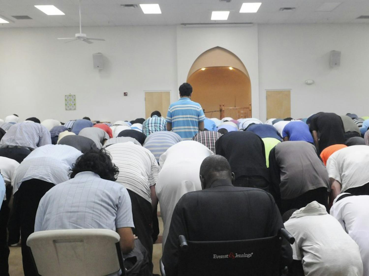 Muslim citizens pray during Praying Session on Friday afternoon in the Albuquerque Islamic Center. Muslims around the world are celebrating the holy month of Ramadan until July 17. 