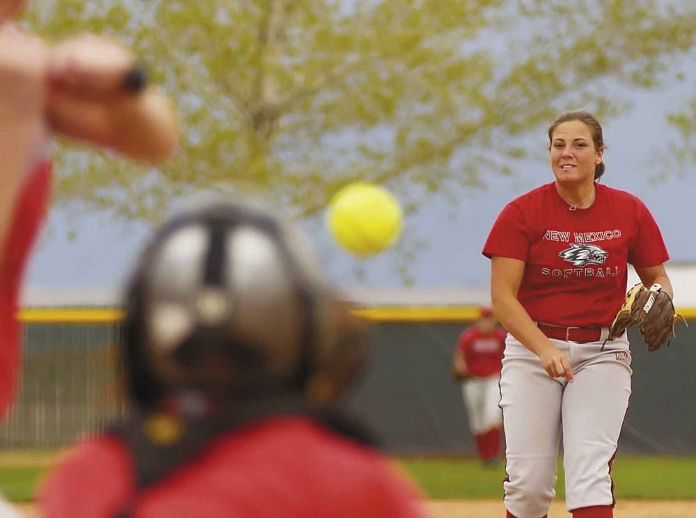 Pitcher Tori Rogers throws to catcher Liz Young during practice at Lobo Field on Wednesday. 