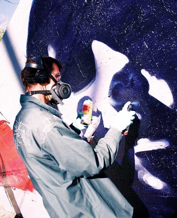 Artist the Mac paints a wall east of Pop 'n' Taco on Central Avenue on Oct. 6 as part of Bomb the Canvas at the North Fourth Art Center.