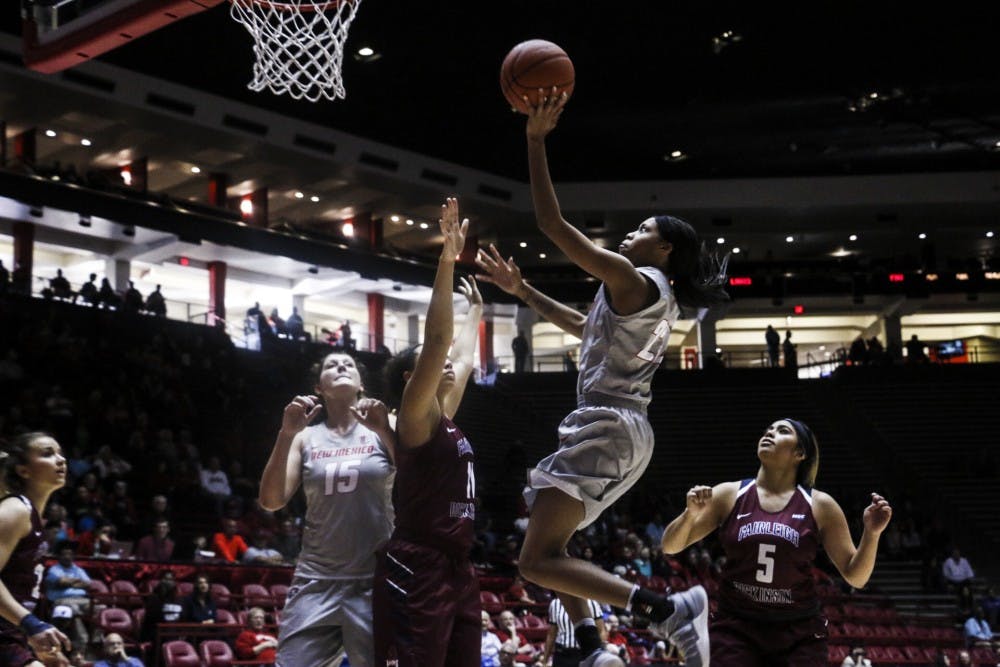 Freshman Mykiel Burleson leaps in the air for a lay up against Fairleigh Dickinson players Saturday, Nov. 12, 2016 at WisePies Arena.&nbsp;