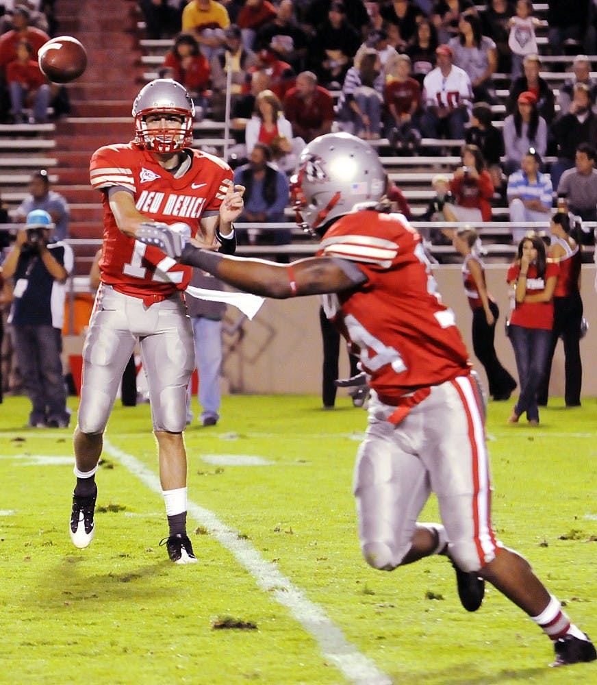 	Backup quarterback B.R. Holbrook throws a swing pass to tailback A.J. Butler in this file photo. Holbrook and quarterback Donovan Porterie will both play in Saturday’s game against in-state rival NMSU. 