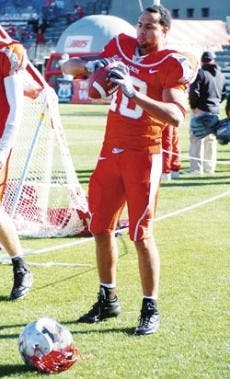 Former Lobo wide receiver Hank Baskett warms-up on the sidelines during the Nov. 19 game against Air Force at University Stadium.