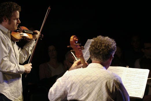 Violinist David Feldberg and cellist Felix Wurman perform at the Church of Beethoven Sunday. 
