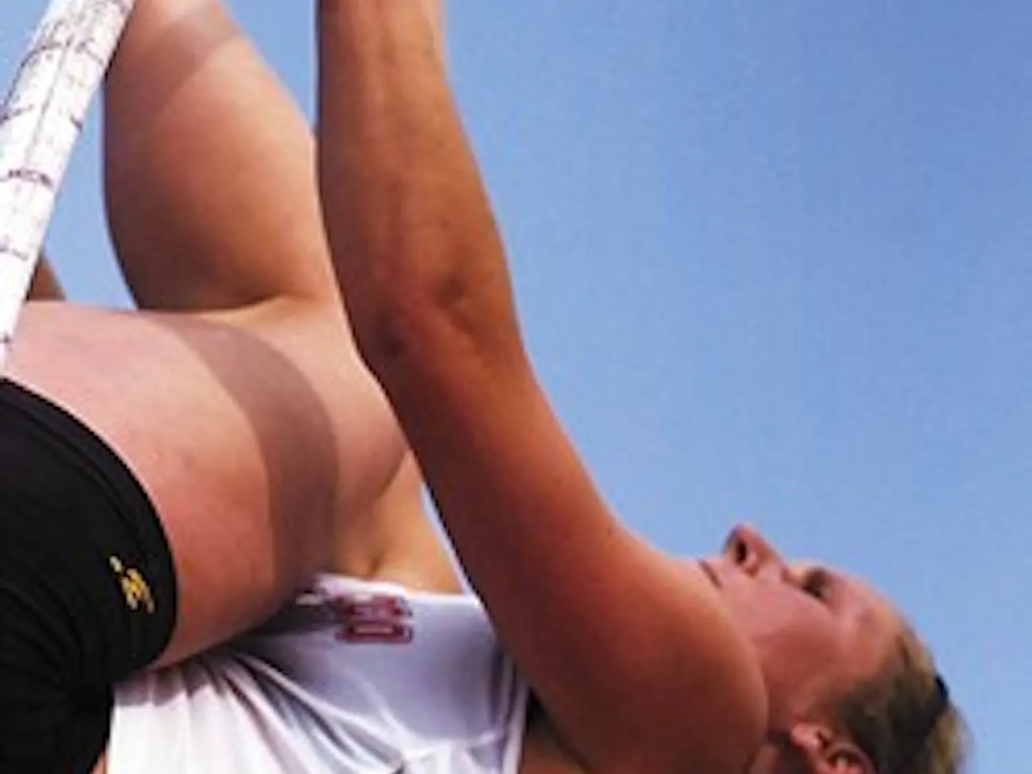 Lobo pole vaulter Whitney Johnson attempts to clear the practice bar Thursday at the Great Friends of UNM Track Stadium. Johnson vaulted 13-00 1/4 to set the UNM women's pole vault record April 29.