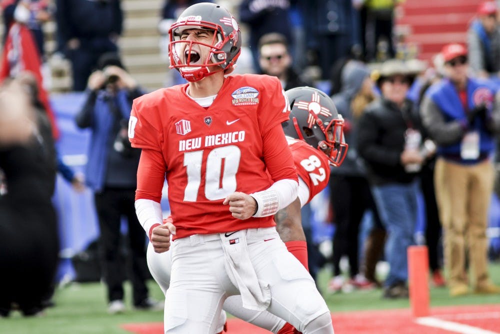 Redshirt senior quarterback Austin Apodaca celebrates in the end zone after running in a touch down against Arizona University Saturday December 19, 2016 at University Stadium. Apodaca is one of two quarterbacks the Lobos will utilize this season.&nbsp;