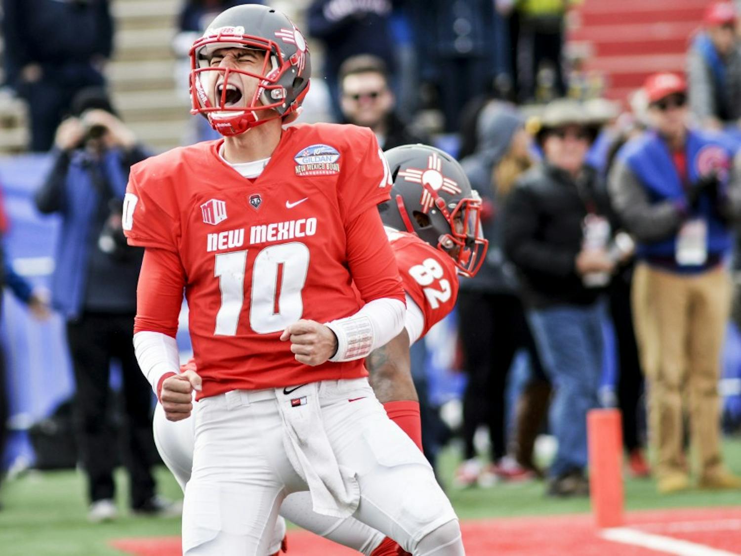 Redshirt senior quarterback Austin Apodaca celebrates in the end zone after running in a touch down against Arizona University Saturday December 19, 2016 at University Stadium. Apodaca is one of two quarterbacks the Lobos will utilize this season. 