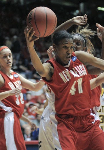 Brandi Kimble grabs a rebound Saturday against West Virginia at The Pit. The Lobos lost the NCAA Tournament game 61-60. 
