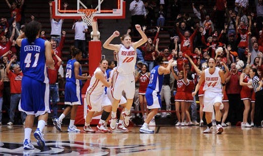 The UNM women's basketball team celebrates after winning 68-66 during the Travelers Tip-Off Tournament title game against DePaul at The Pit on Monday. Lobo point guard Amy Beggin, center, scored the game-winning basket in the final seconds. 