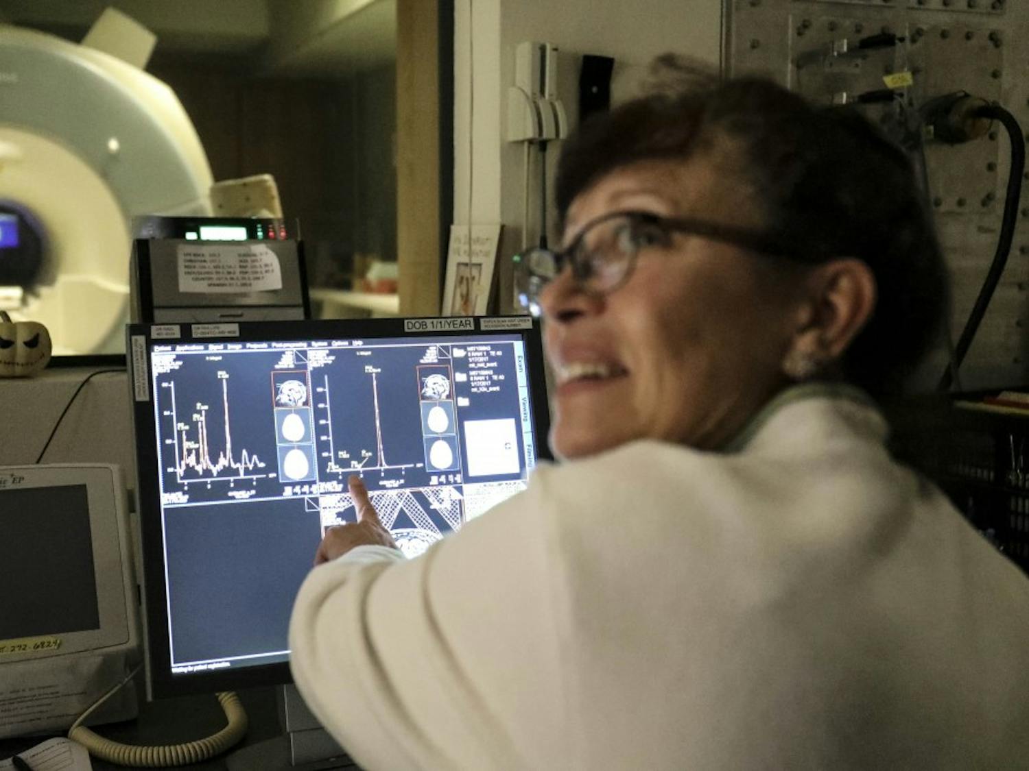 MRI manager of the Pete and Nancy Domenici Center, Diana Smith, Shows reporters brain activities and MRI scans on Dec. 06, 2017.  