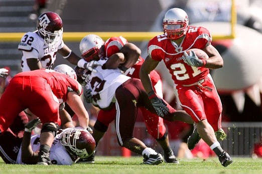 UNM tailback Rodney Ferguson breaks away from the pack to score a touchdown during Saturday's 22-28 loss against Texas A&M at University Stadium.