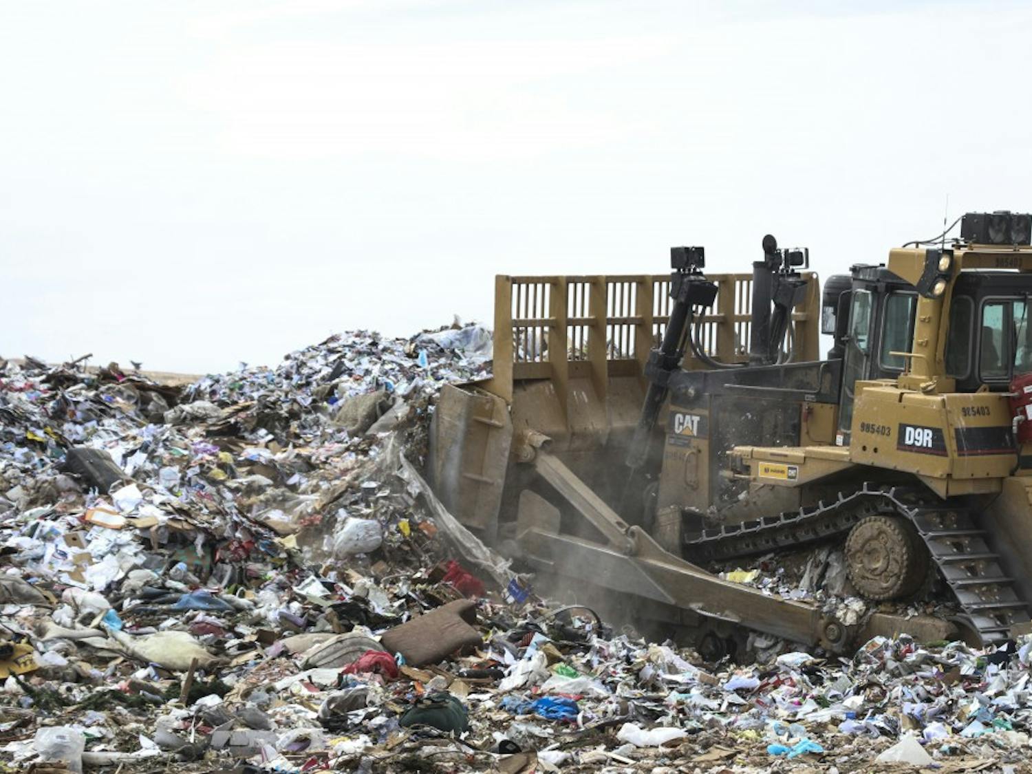 A tractor blows a freshly dumped pile of garbage at the Cerro Colorado Landfill on April 6, 2018.&nbsp;