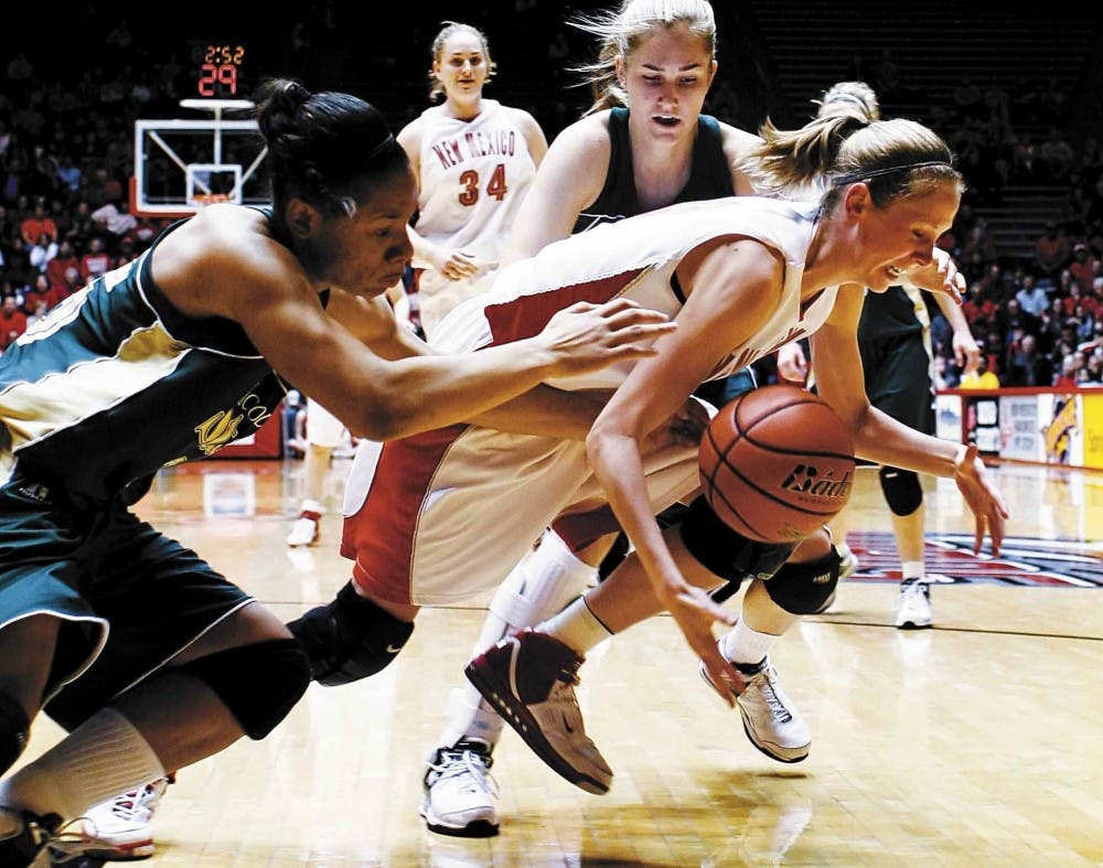 Lobo guard Julie Briody fights for possession of an offensive rebound during Wednesday's 77-66 win over Colorado State at The Pit. 