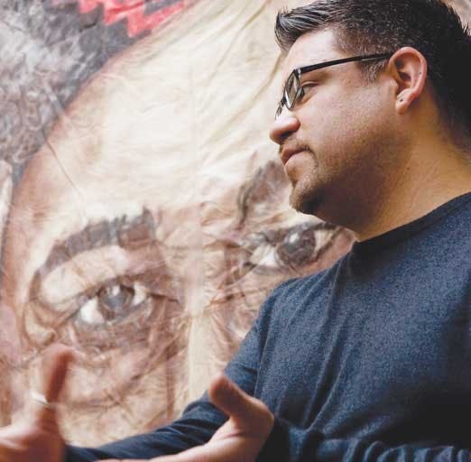 GPSA President Christopher Ramirez speaks in the SUB on Tuesday during a celebration of Cesar Chavez's 82nd birthday. The event was hosted by Raza Graduate Student Association, El Centro de la Raza, GPSA and Movimiento Estudiantil Chicana/o de Aztlan. Par