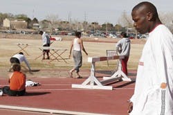UNM sprinter Aaron Brack walks to the starting blocks during a March 30 track practice at the Great Friends of UNM Track Stadium.