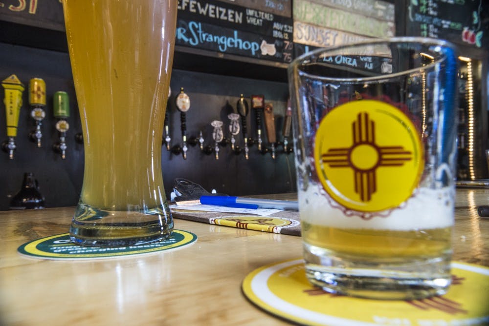 Drinks and receipts lay on&nbsp;the bar of Santa Fe Brewery's tap room located at Green Jeans Farmery on Sunday, August 28, 2016. A group of UNM students has proposed the opening of a tap room similar to Santa Fe's on main campus.&nbsp;