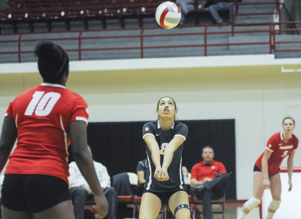 	Lobo redshirt freshman outside hitter Ashley Kelsey keeps the ball in play during the Lobo Alumnae game at Johnson Gym on Saturday night. The Lobos will open their season against Seattle U this afternoon.