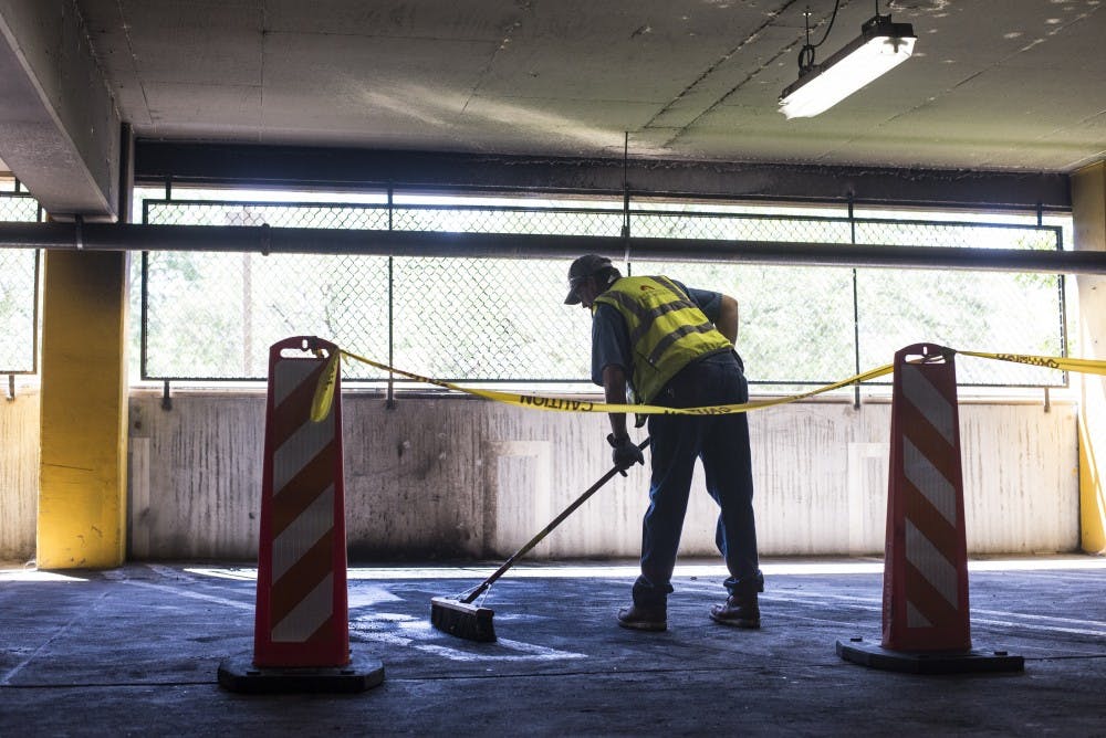 An SUV caught fire in the Lomas parking structure Tuesday morning. Two other cars suffered damage, but the structure was unharmed.