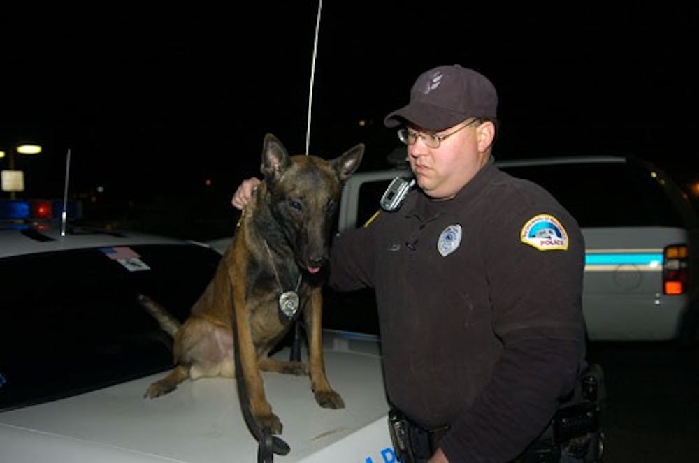 Ultra, UNM's police dog, received a commemorative plaque Friday at a ceremony in his honor. Ultra helped recover 500 pounds of stolen explosives from New Mexico and Colorado.