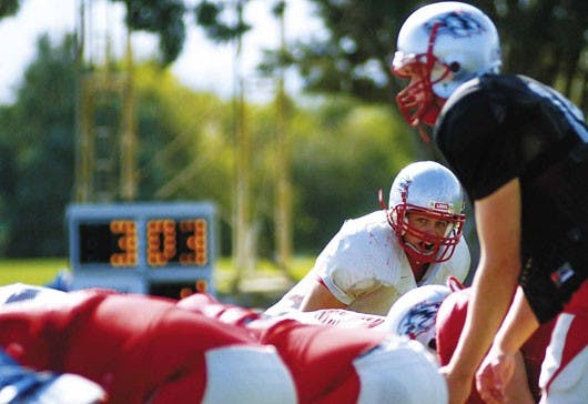 Linebacker Cody Kase looks over the offense during a team scrimmage at the Lobo football practice field Wednesday.  