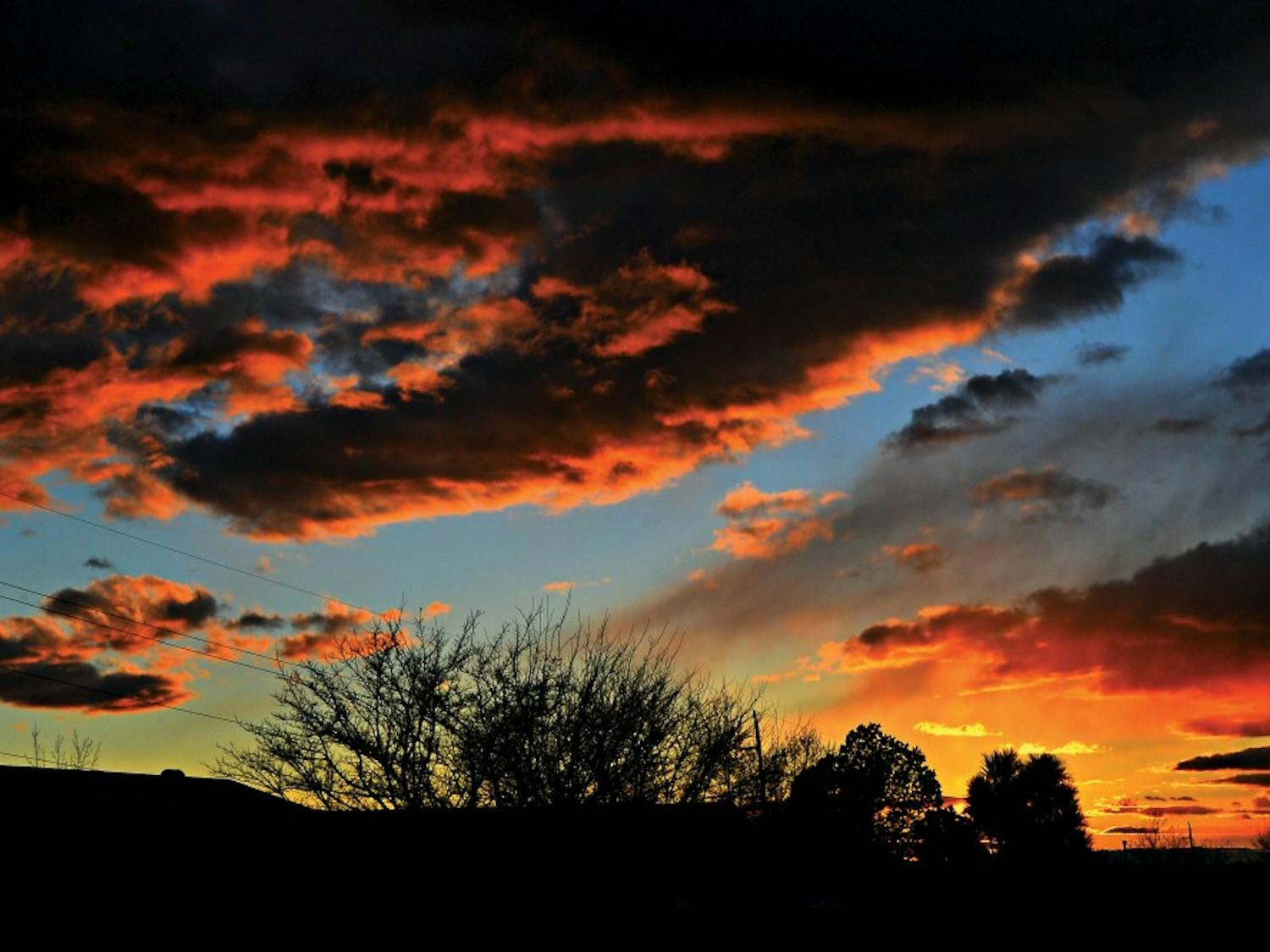 A New Mexico sunset graces the sky near the Heights area on a November 15, 2014. New Mexico is known for its breathtaking sunsets.
