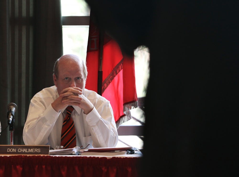 	Regent Don Chalmers listens to a presentation during the budget summit Friday in the SUB. The Board of Regents voted to increase tuition
and fees 7.9 percent, or $405.