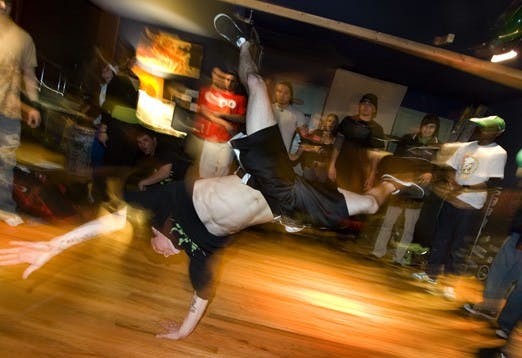 Ricky Rodriguez break dances at Duke City Sabor at 114 Fourth St. S.W. on Saturday.