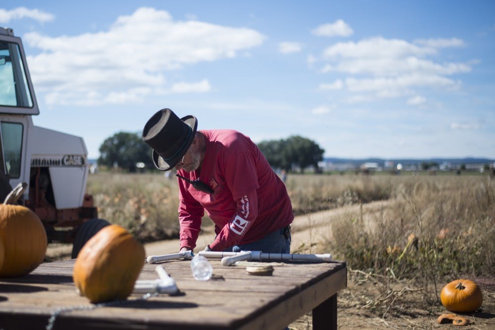Bill Raupfer fixes a PVC tool that is used by attendees at McCalls Pumpkin patch to gauge how much their pumpkin will cost. Raupfer is a six year veteran an McCalls whos work responsibilities range from driving tractors to aiding people in their pumpkin picking.