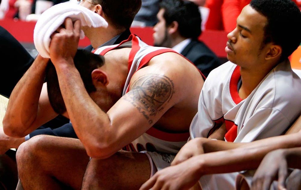 Lobo guard Jamaal Smith, right, looks at a frustrated Aaron Johnson in the second half of the Lobos' 85-83 loss to UNLV on Wednesday at The Pit. 