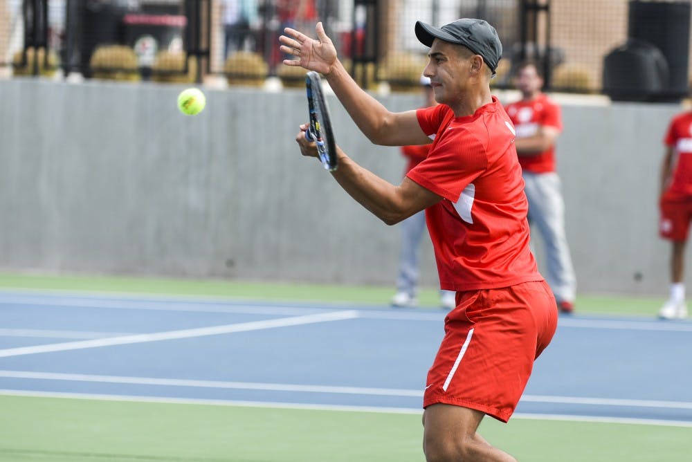 Sophomore Jorge Escutia braces to return the ball at the McKinnon Family Tennis Stadium. The Lobos will play Utah State and Boise State this weekend in Albuquerque.