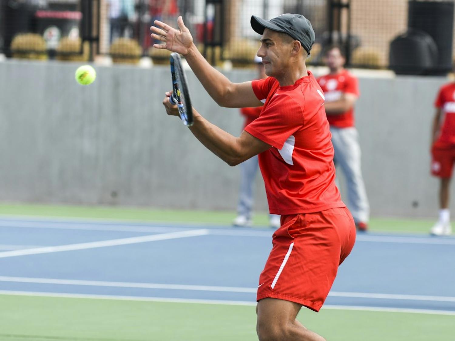 Sophomore Jorge Escutia braces to return the ball at the McKinnon Family Tennis Stadium. The Lobos will play Utah State and Boise State this weekend in Albuquerque.