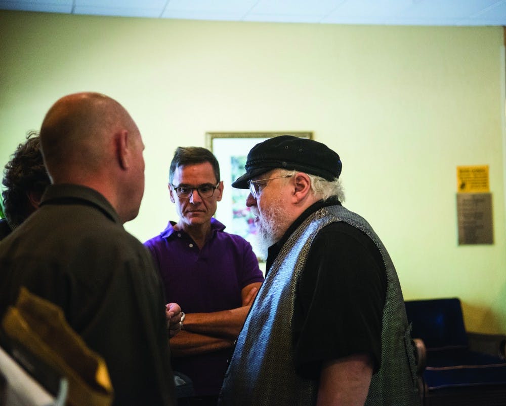 George R. R. Martin preps with his video team moments before heading into his panel discussion at Bubonicon 47. Martin’s popularity has grown with the HBO series Game of Thrones, which was based on his novels.