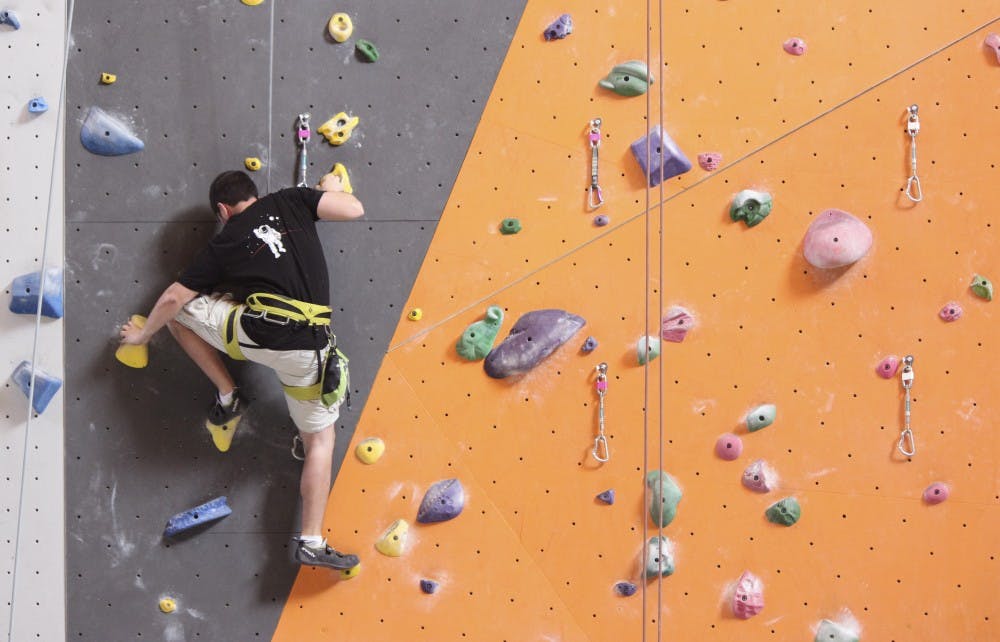 Zach Gallegos climbs at Stone Age Climbing Gym as part of his training to earn a potential spot for the Mars One Mission. 