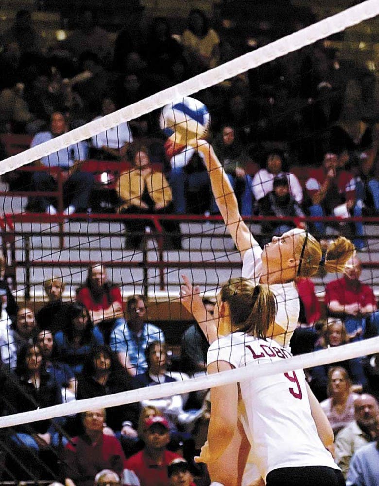 Lobo volleyball senior Kelly Therkelsen returns the ball during UNM's sweep over TCU at Johnson Gym on Friday.