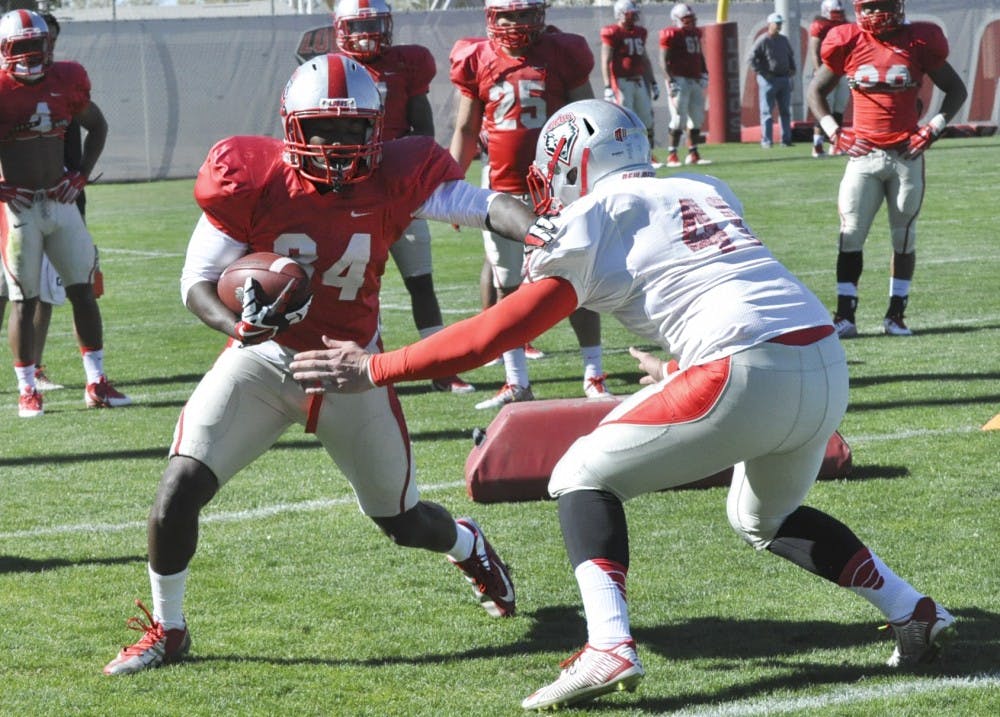 Carlos Wiggins eludes a defender during the Lobos spring training April 8. at Tow Diehm Complex. 